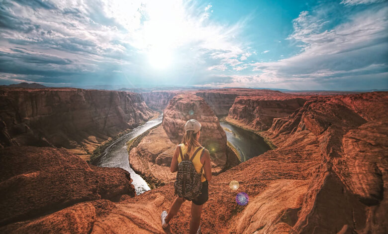 Woman standing on top of canyon
